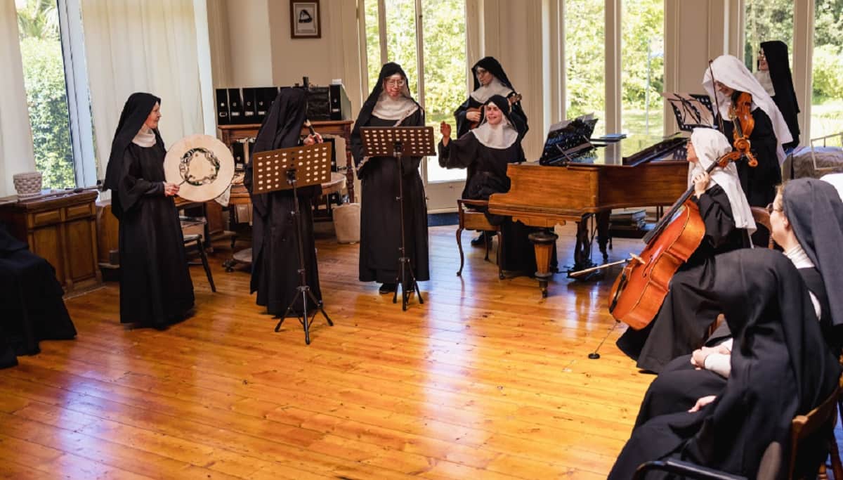 Nuns rehearsing their instruments.
