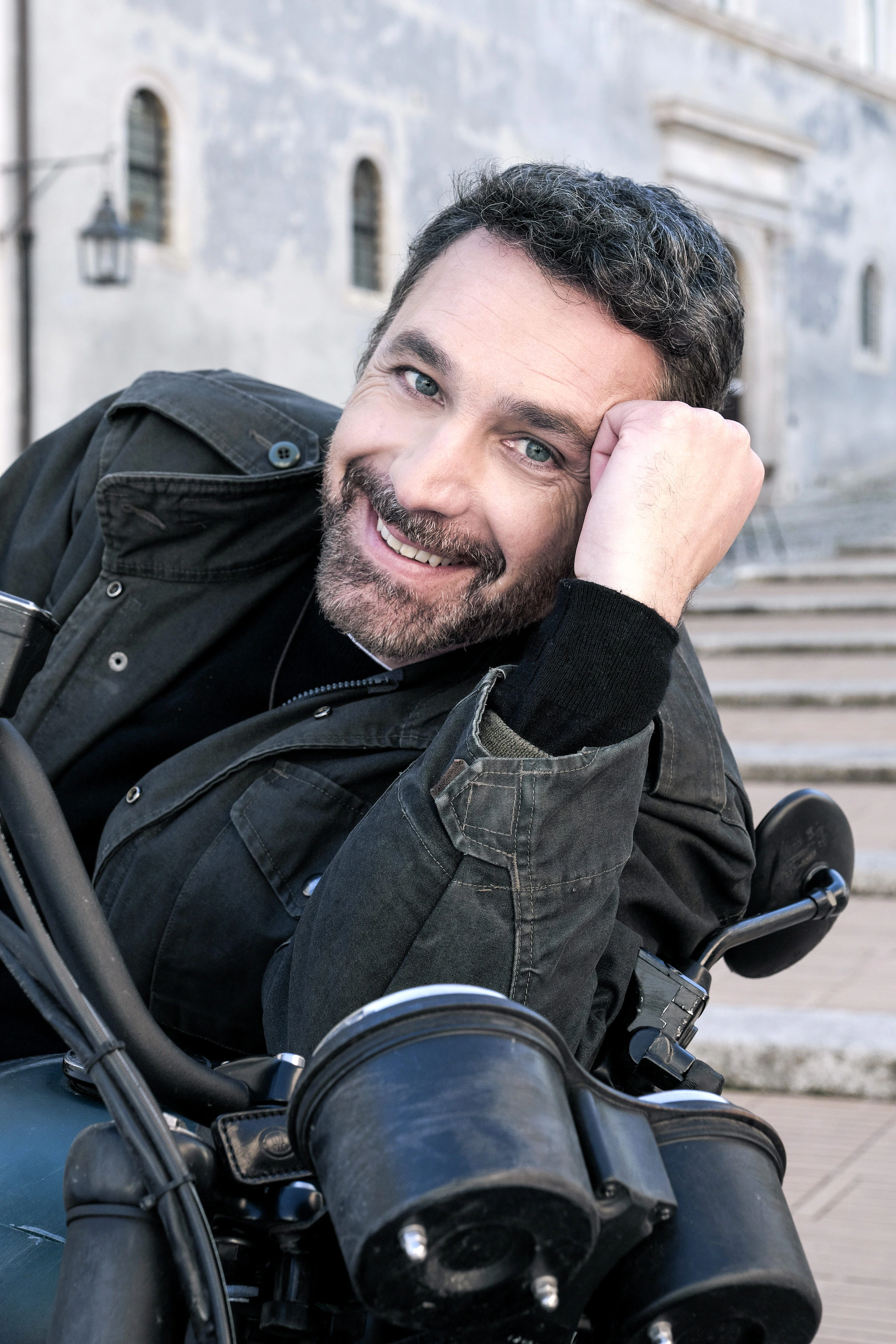Raoul Bova riding his motorcycle in the role of Don Massimo