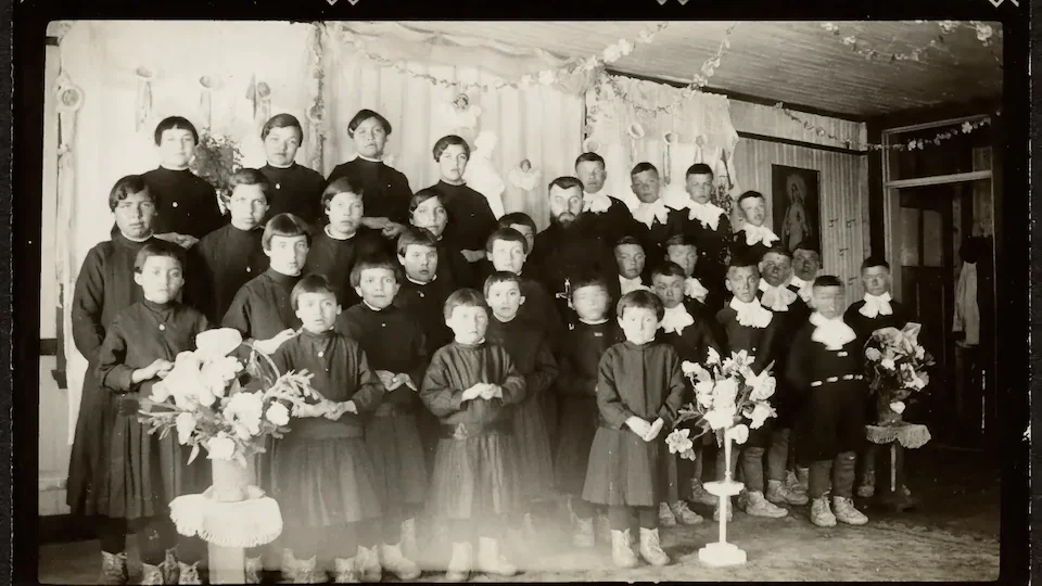 Black and white photo of a group of young people all dressed similarly.