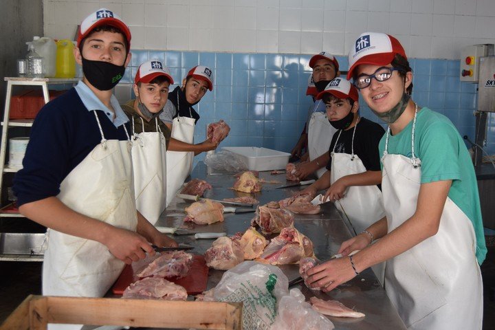 A group of students during a chicken slaughter in Ferré.