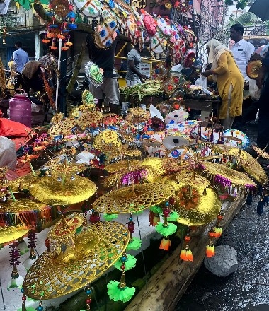 A stand of golden umbrellas for Ganesh in Pondicherry