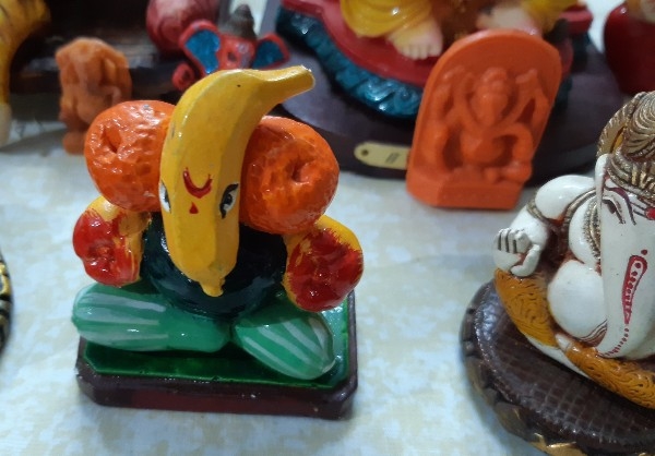 A mini Ganesh with a banana trunk