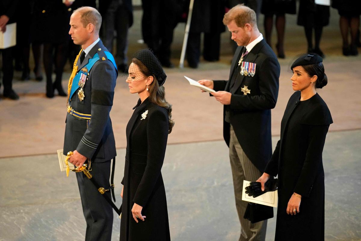 Princes William and Harry, accompanied by their wives.