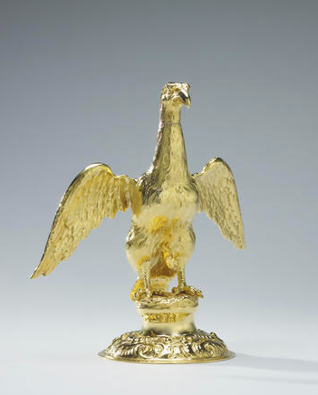 The eagle's head is removable and there is an opening in the beak for pouring oil.