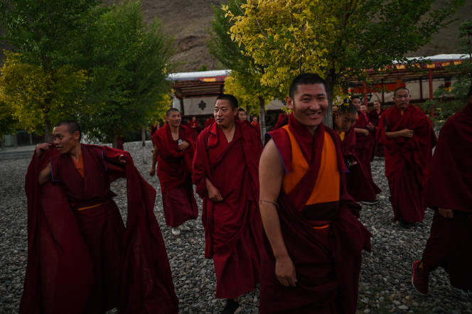 Monks take a walk during a government-organized media tour in Lhasa, Tibet on May 31, 2021.