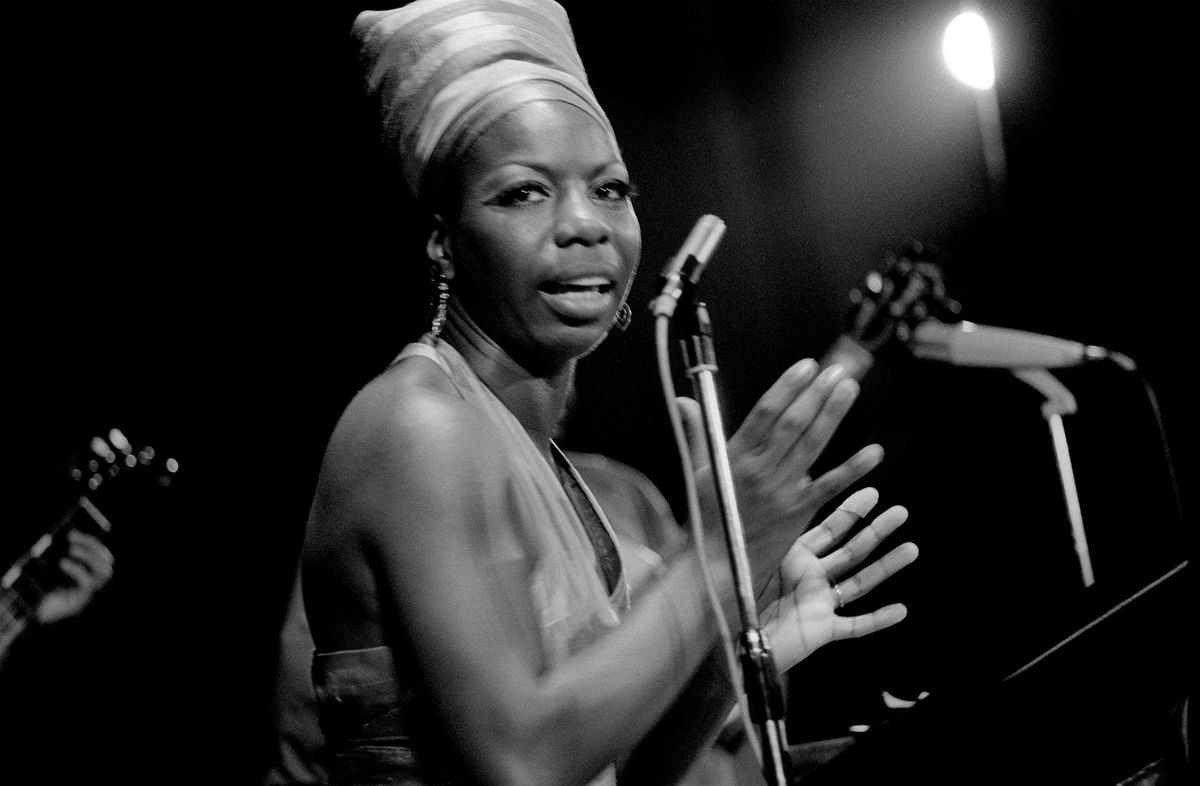 American jazz singer Nina Simone in concert.  Warren Ellis grabbed his chewing gum, snatching it from his piano…