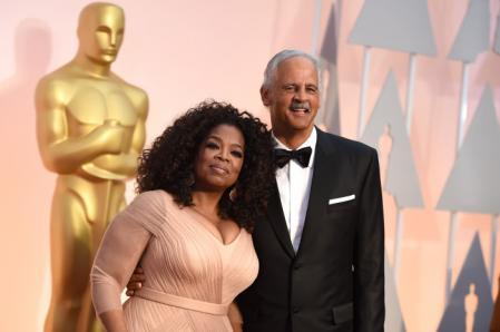 Stedman Graham and Presenter Oprah Winfrey during the 87th Oscars The Annual Academy Awards in Los Angeles on February 22, 2015.