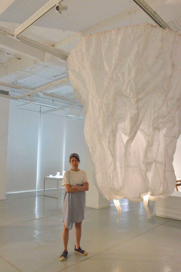 Aili Chen and her work at the Museum of Oriental Art.  Photo Constance Niscovolos