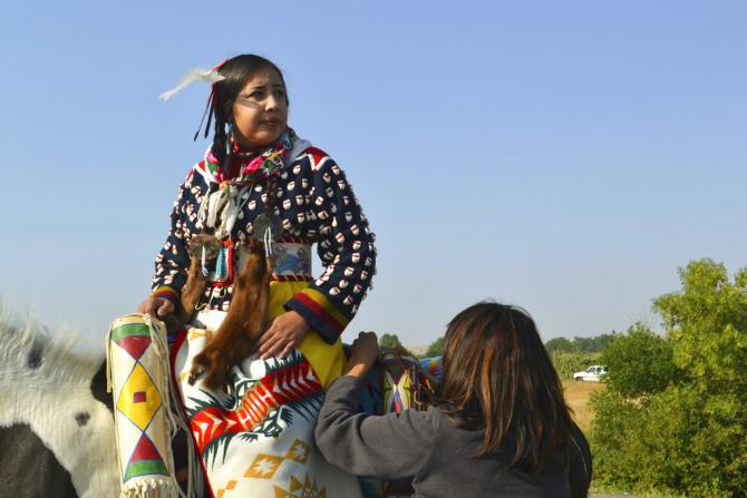 Julia Brien getting ready for the <em>Crow Fair</em>  at Crow Agency, Montana.  For the Crow tribe, the dance of the <em>Crow Fair</em>  marks the new year of the tribe.